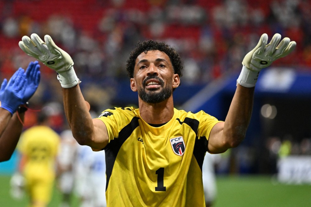 Vozinha celebrates after the Spain match