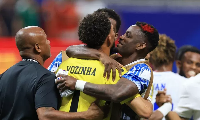 Cape Verde teammates embrace Vozinha after the Spain match